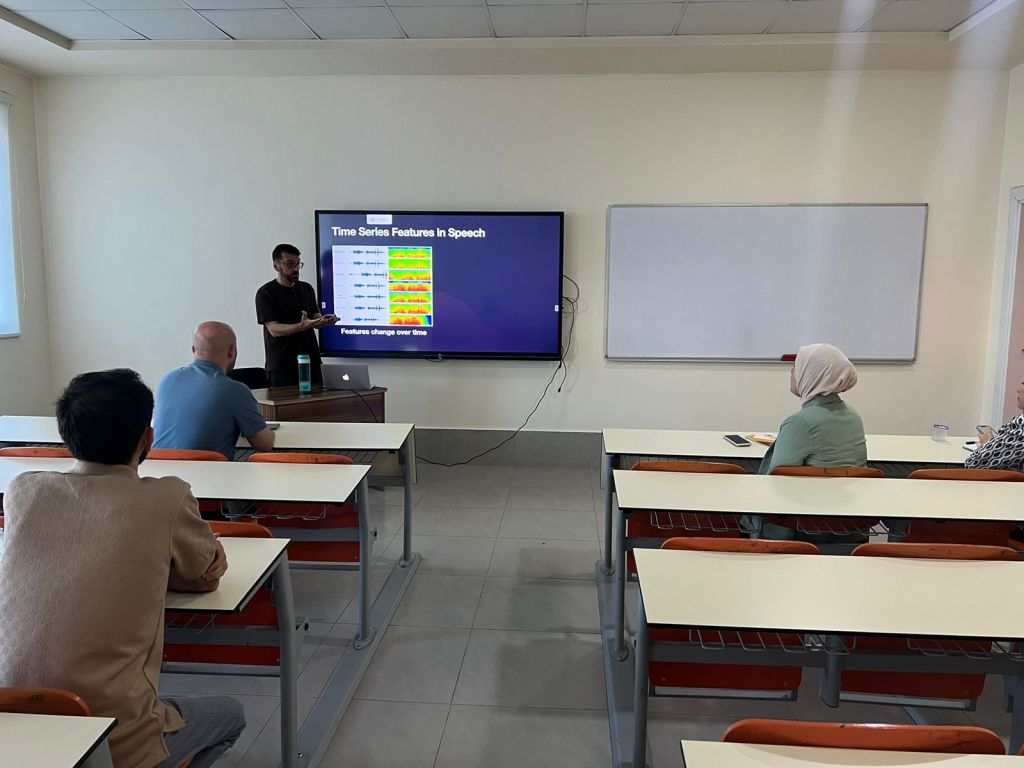 Dr. Hemin Ibrahim presenting "Time Series Features in Speech Emotion Recognition" seminar to the IT department staff at Tishk International University, focusing on improving mental health support.